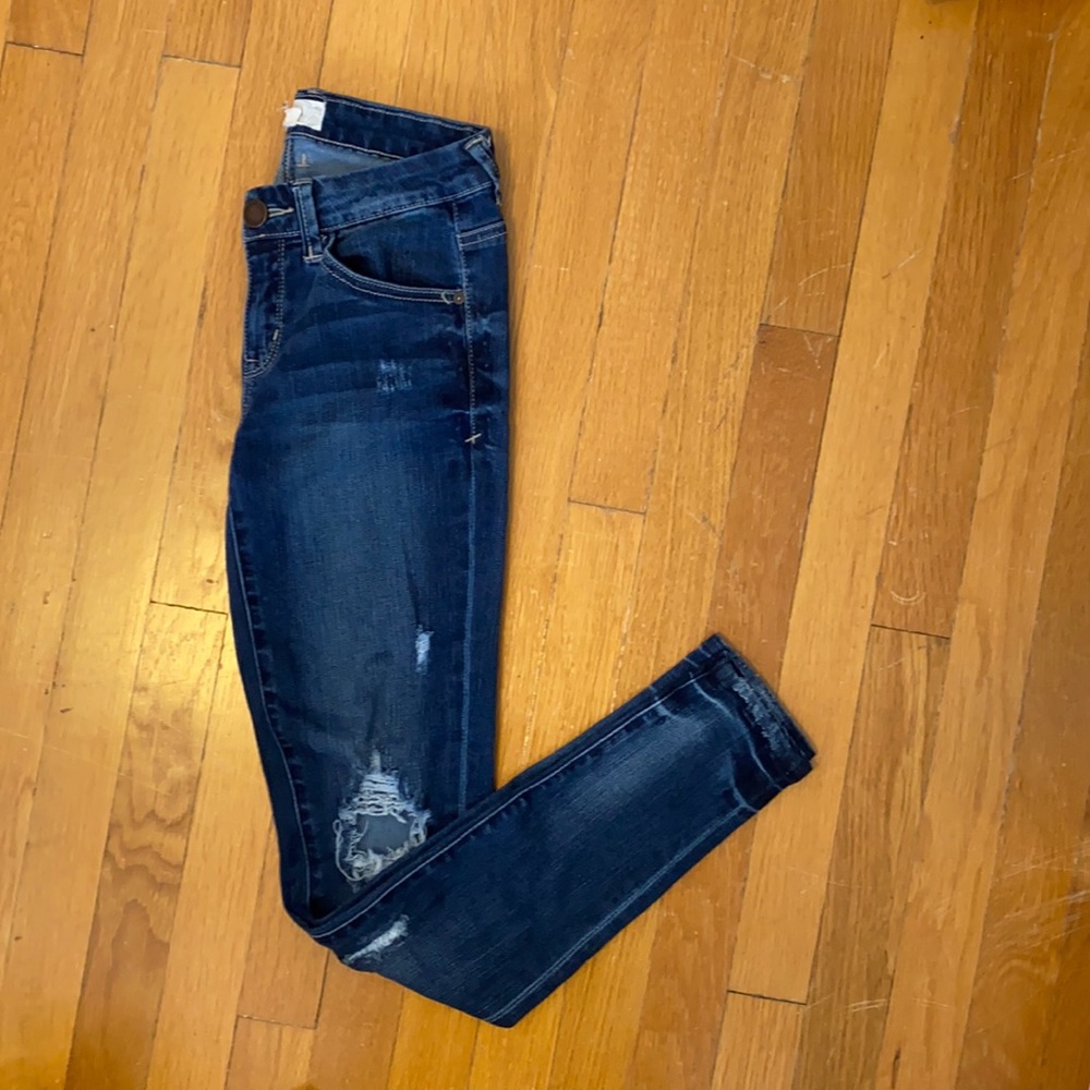 Skinny distressed dark wash low rise jeans